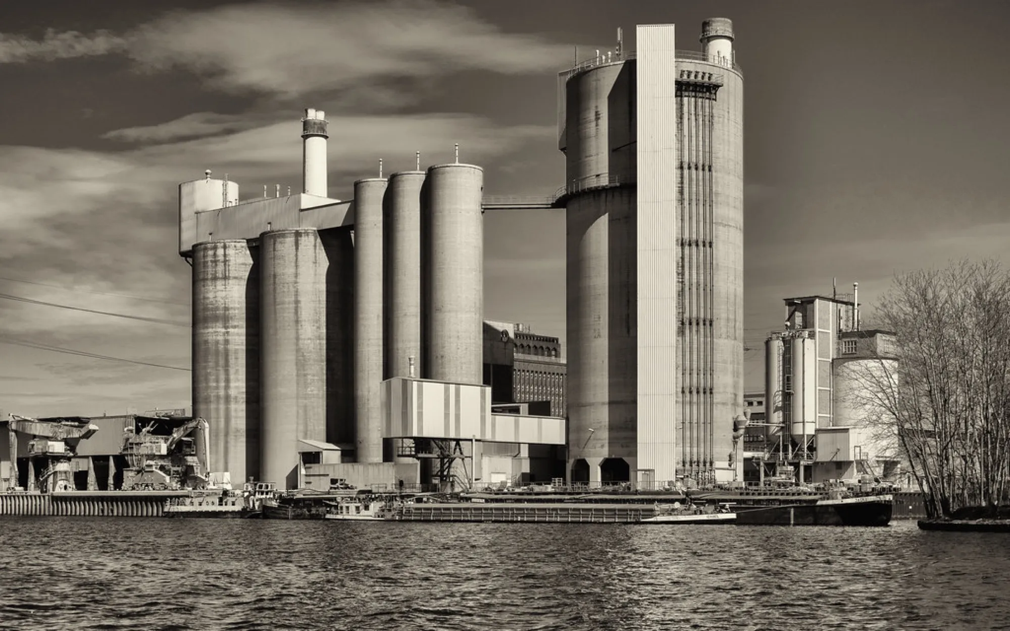 Cement plant with tall silos and a preheater tower